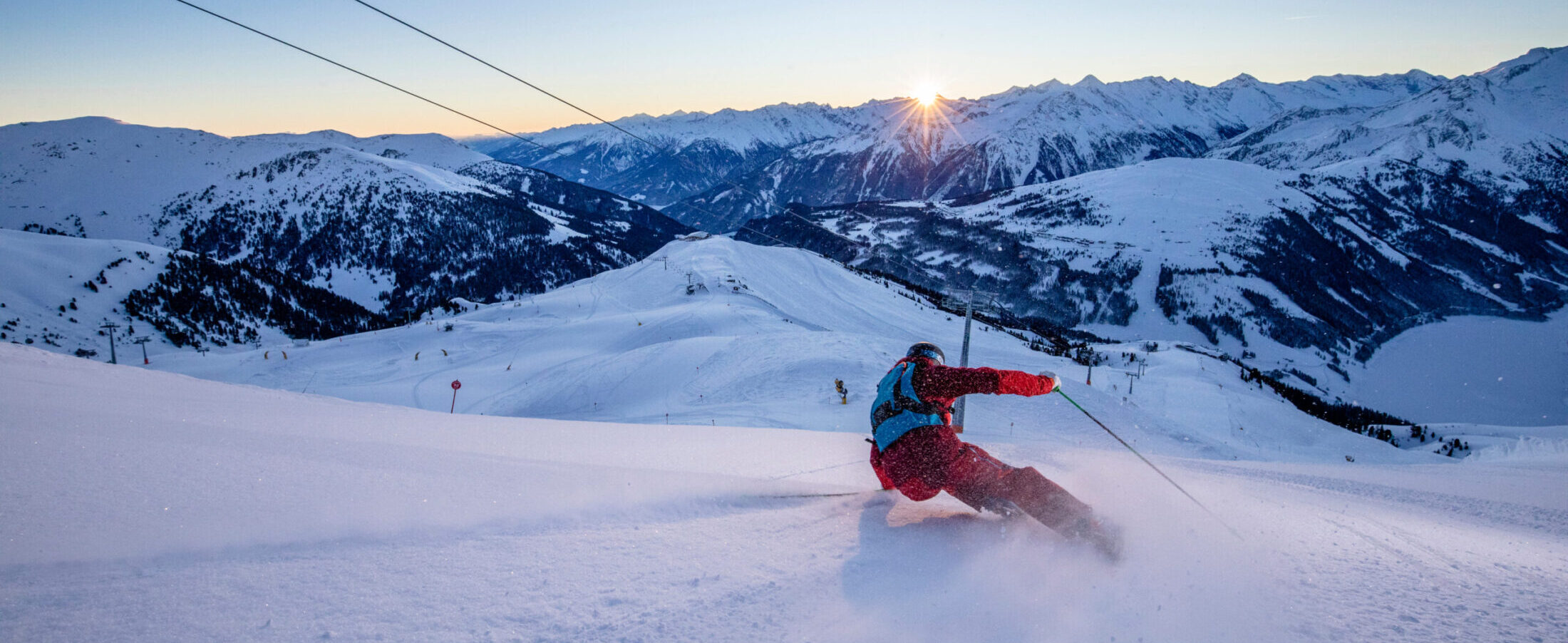 Alpin Luxe Ski Vacations - Skier in the Dolomites at last light