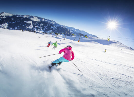 Alpin Luxe Ski Vacations - skiers on a wide open piste in the Zillertal