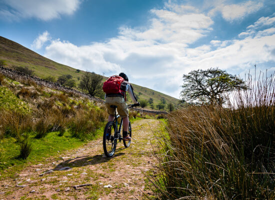 Brecon/ Wales-April 1st 2014: A man mountain biking in the Brecon Beacons National Park, Wales on a sunny day.